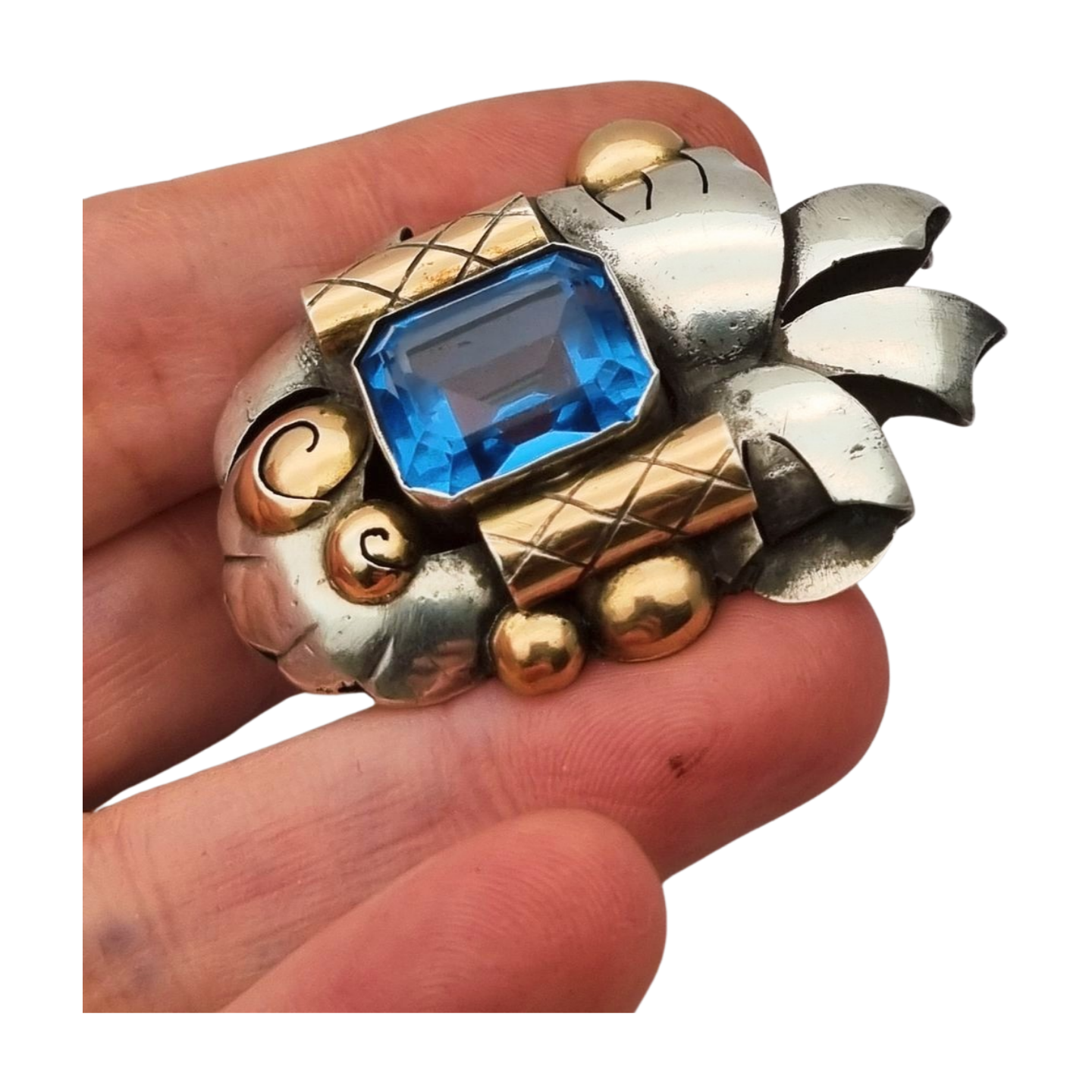 Art Deco Catalan brooch in silver with gold accents and simulated aquamarine, circa 1930-1940