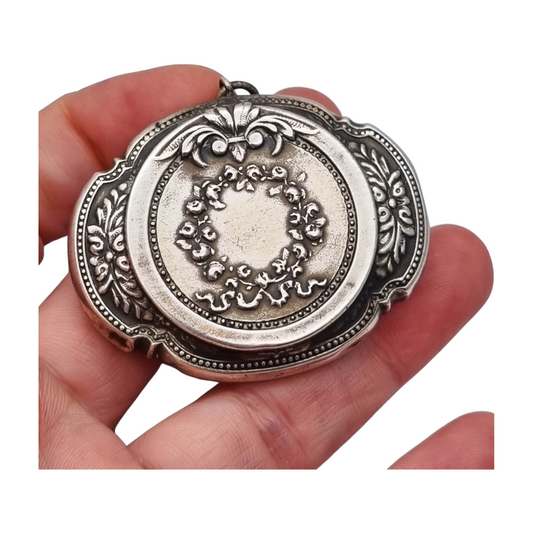 Antique Art Nouveau silver chatelaine powder compact with interior mirror, floral design, circa 1920.