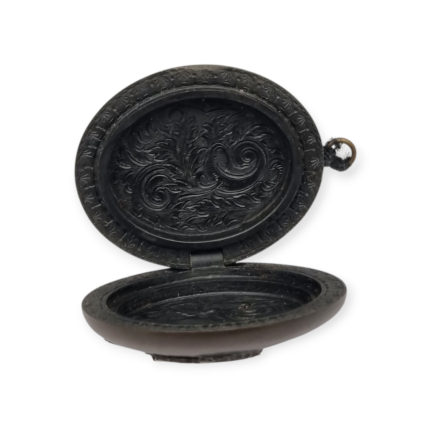 Victorian vulcanite locket, mourning jewelry, raised flower, England circa 1890-1900