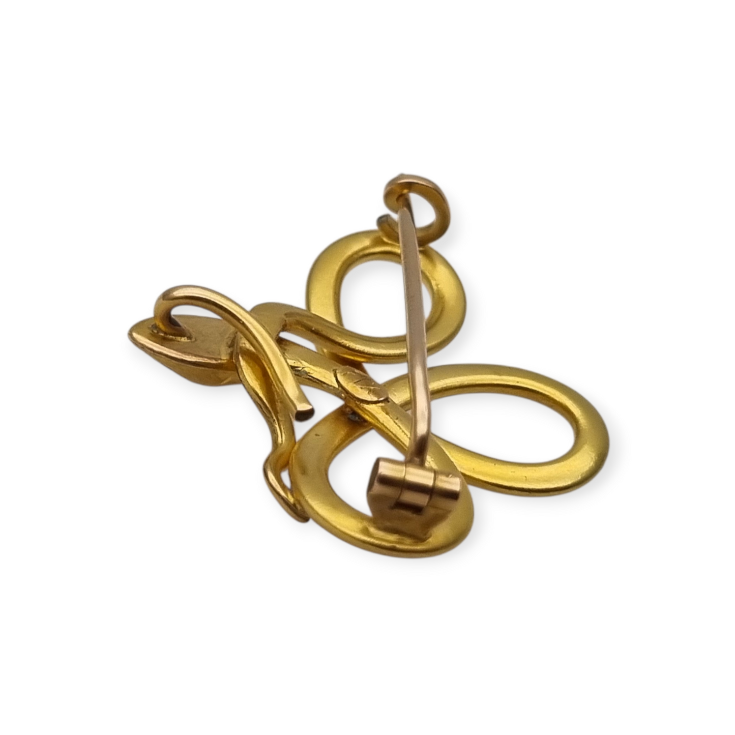 Broche francés FIX con serpiente entrelazada., oro laminado y piedra roja circa 1910
