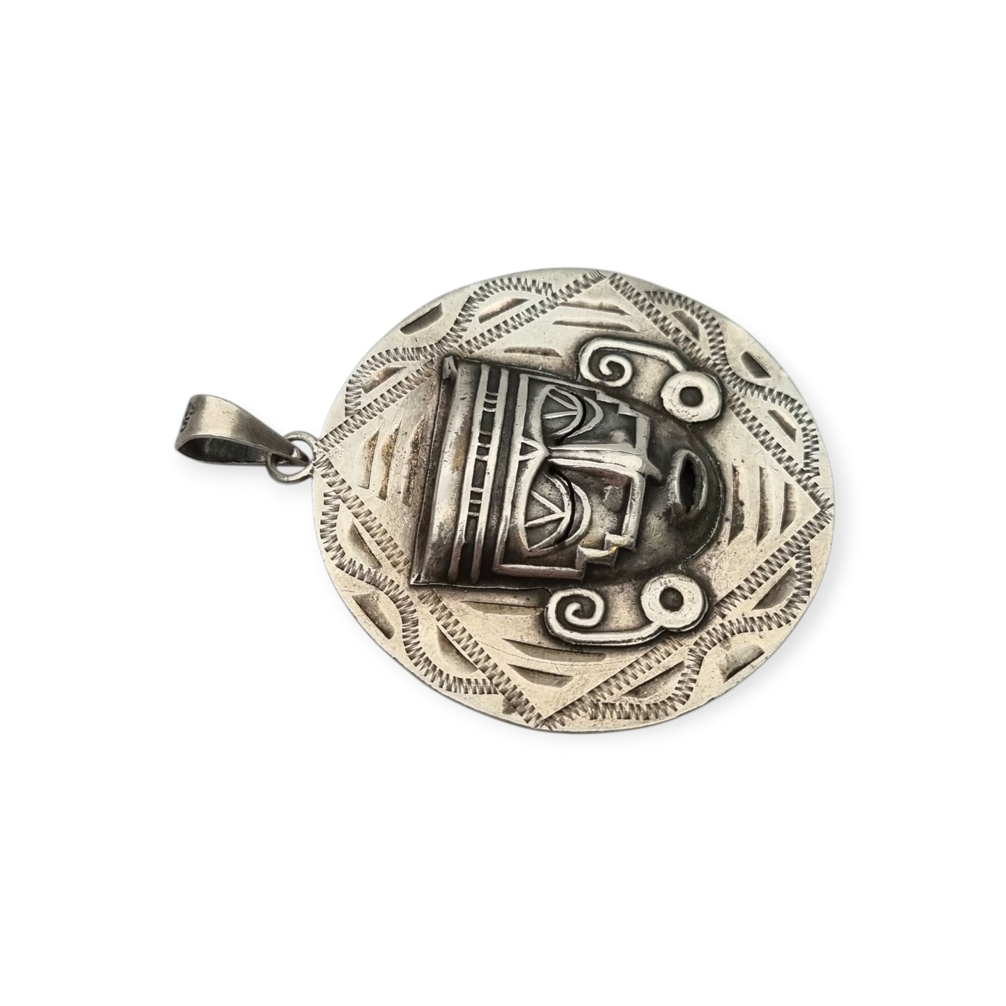 Reversible .925 sterling silver Aztec calendar and mask pendant, Mexico, 1960s-70s
