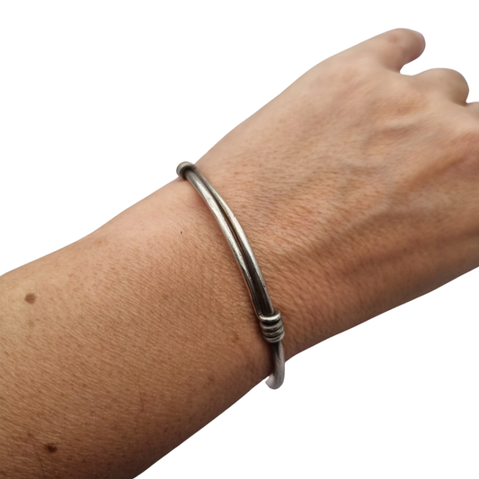 Vintage ethnic silver African knot bracelet, rigid artisan tribal bangle, 20th century
