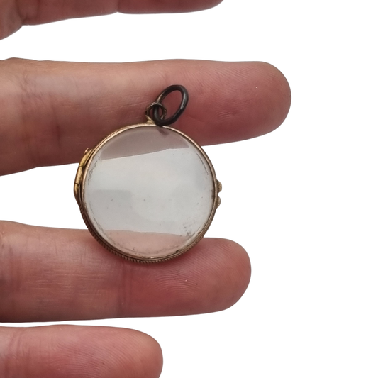 Antique round metal and beveled glass locket pendant, circa 1920