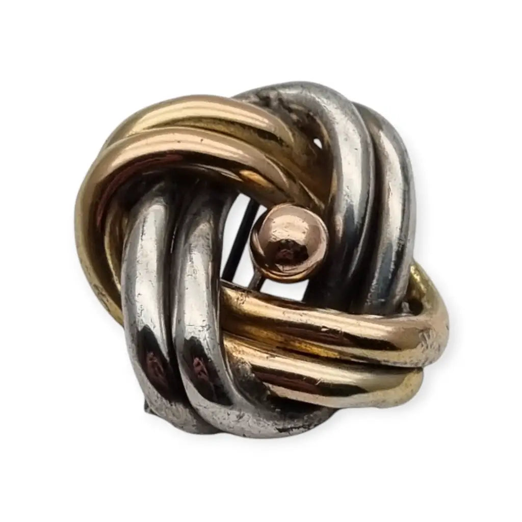 Broche antigua de nudo amor en plata años 40 con diseño simbólico