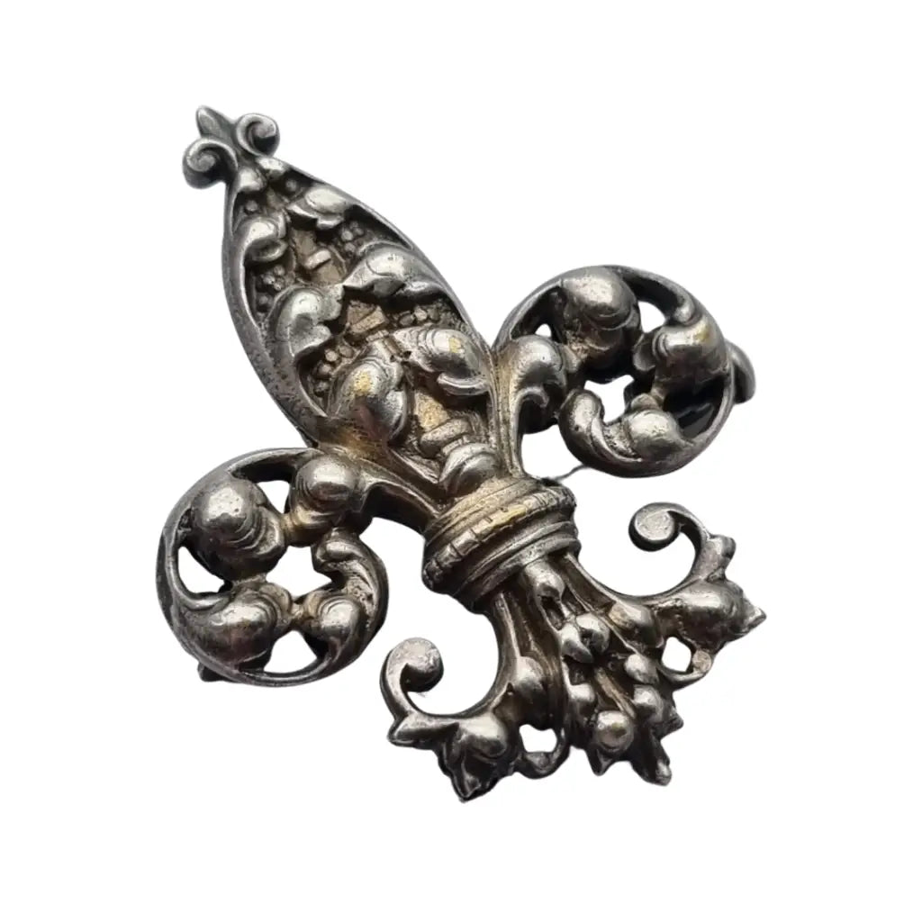 Broche antiguo de plata con flor lis estilo historicista circa 1930.