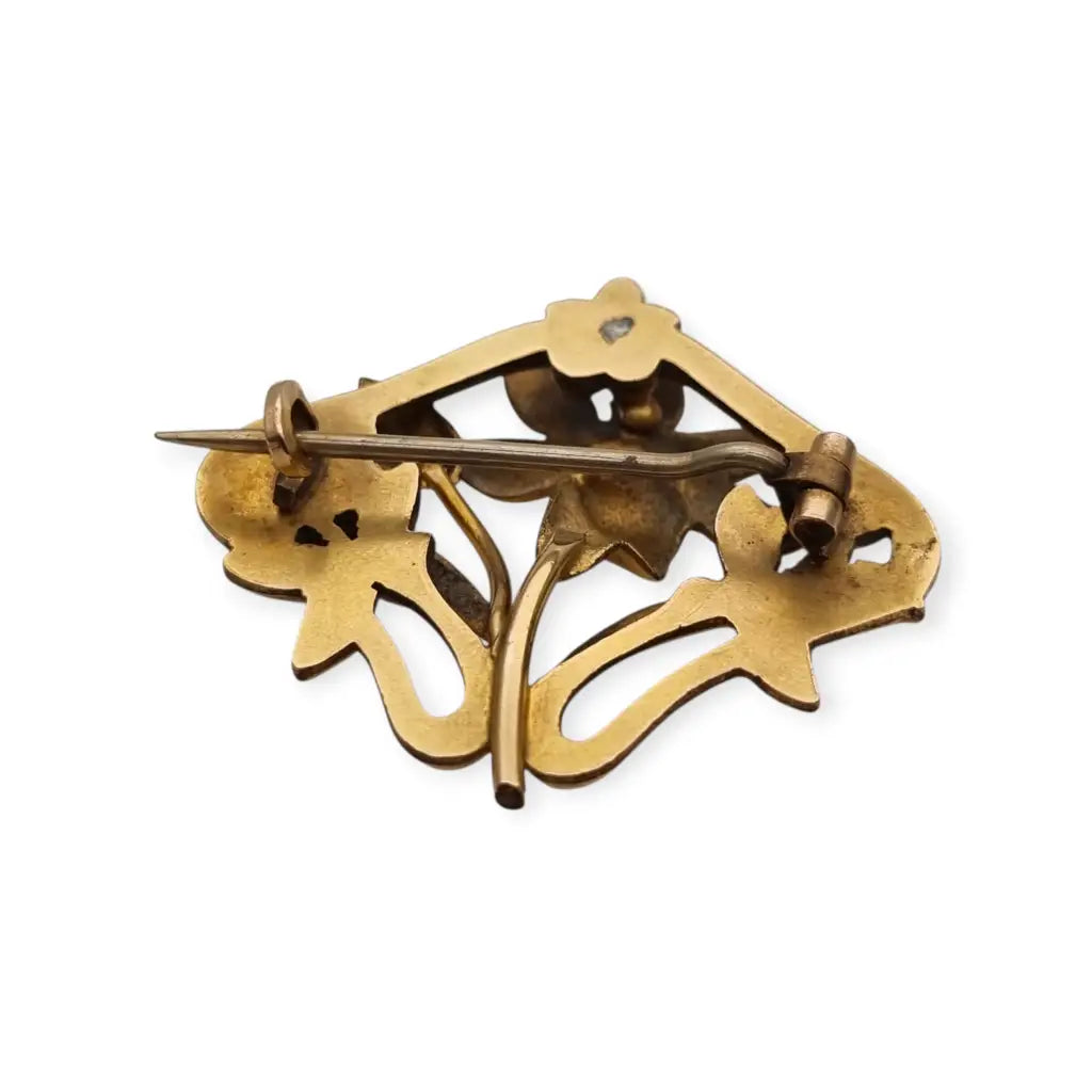 Broche Art Nouveau años 1910‑20 en metal dorado motivo floral. LaBizarreSusu
