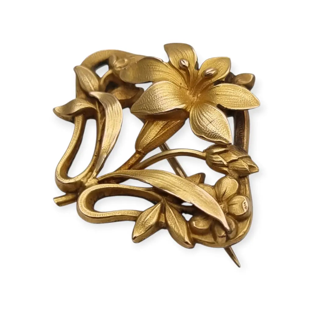 Broche Art Nouveau años 1910‑20 en metal dorado motivo floral. LaBizarreSusu