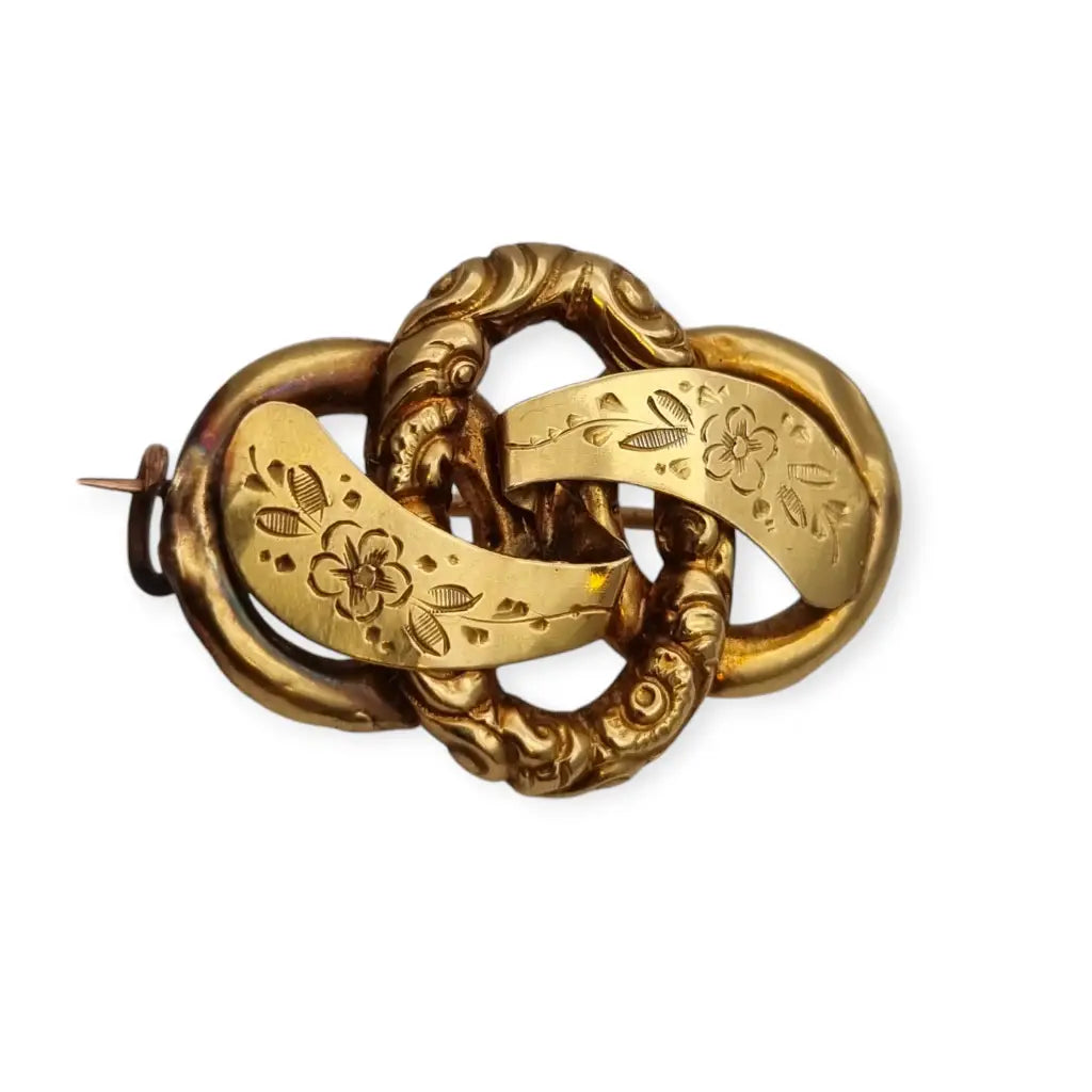 Broche de lazo victoriano Oro 14k con diseño floral grabado 1900.