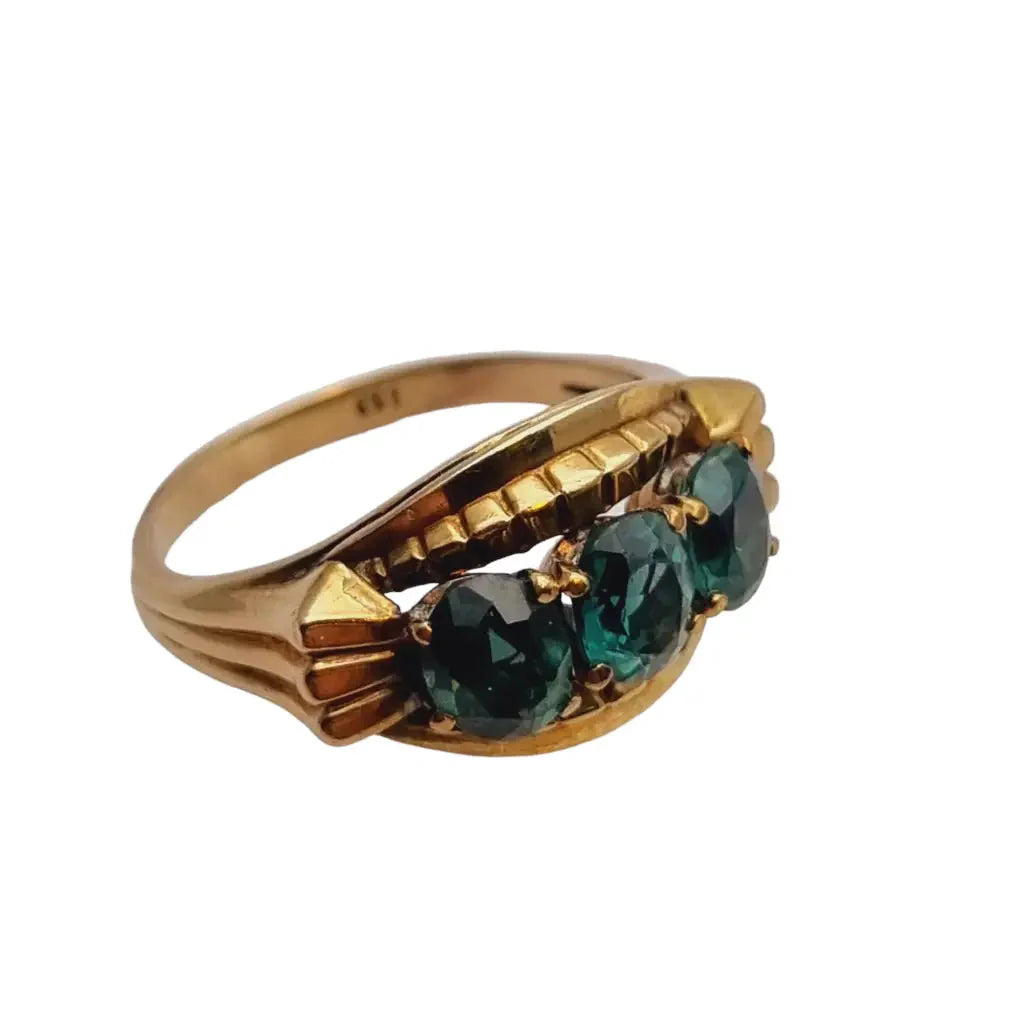 Anillo art déco de oro amarillo 8 kt. 333 piedra azul verdosa circa 1930.