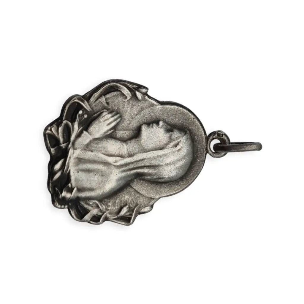 Medalla antigua Art Nouveau en plata con Virgen diseño floral circa 1900–1930