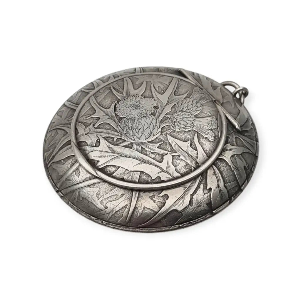 Polvera redonda de plata Art Nouveau con grabado cardos para coleccionista