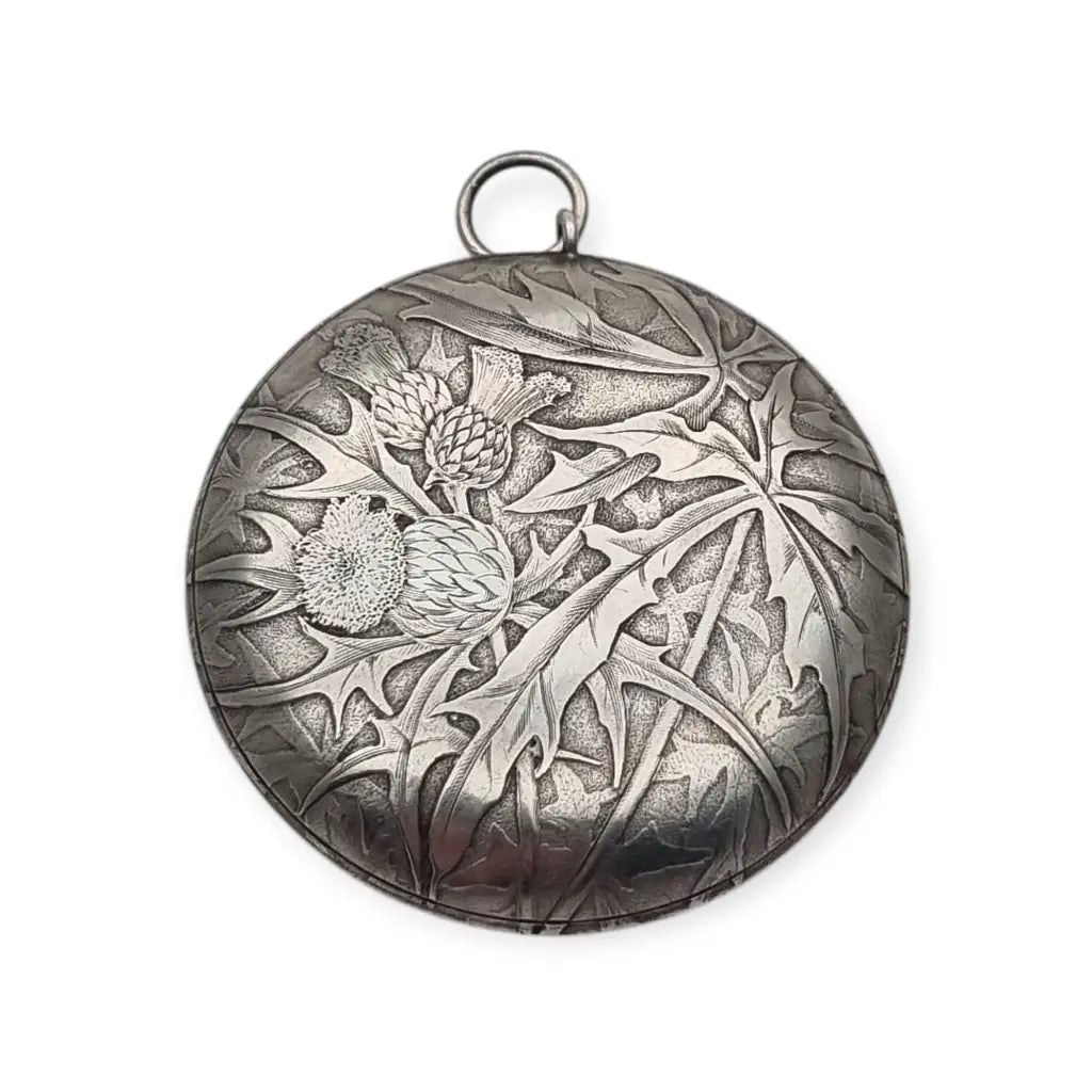 Polvera redonda de plata Art Nouveau con grabado cardos para coleccionista