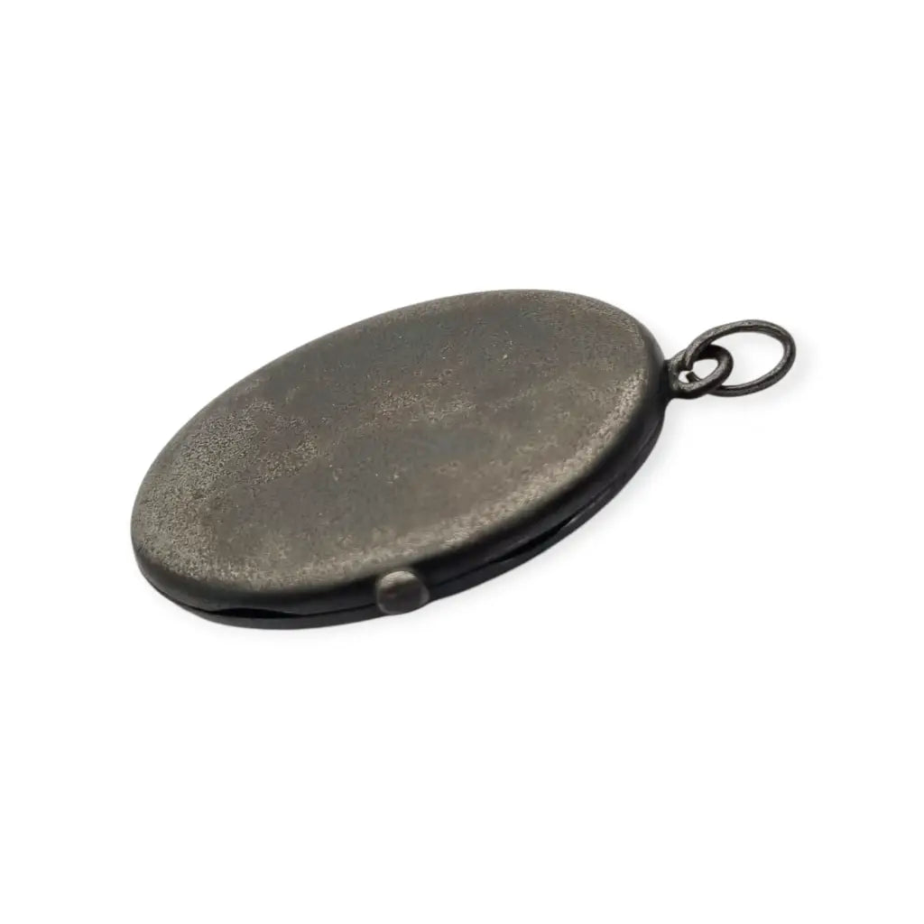 Relicario antiguo Guardapelo ovalado en metal oscuro Victoriano
