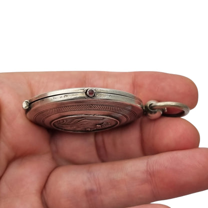 Antique Art Nouveau 800 silver locket with double photo frame, floral engraving, and pink stone, ca. 1900