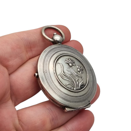 Antique Art Nouveau 800 silver locket with double photo frame, floral engraving, and pink stone, ca. 1900