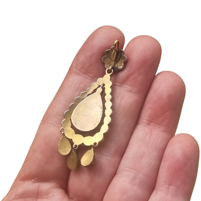 Colgante antiguo victoriano de pedrería granate y metal dorado, tipo girándola, circa 1900