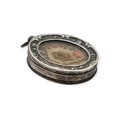Relicario antiguo de plata de la beata Germana de Pibrac con lacre conservado, siglo XIX