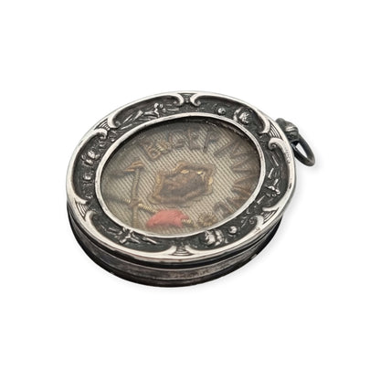 Relicario antiguo de plata de la beata Germana de Pibrac con lacre conservado, siglo XIX