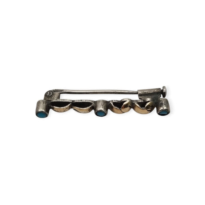 Antique Art Deco silver brooch with gold highlights and blue cabochons, Spain, ca. 1930–1940