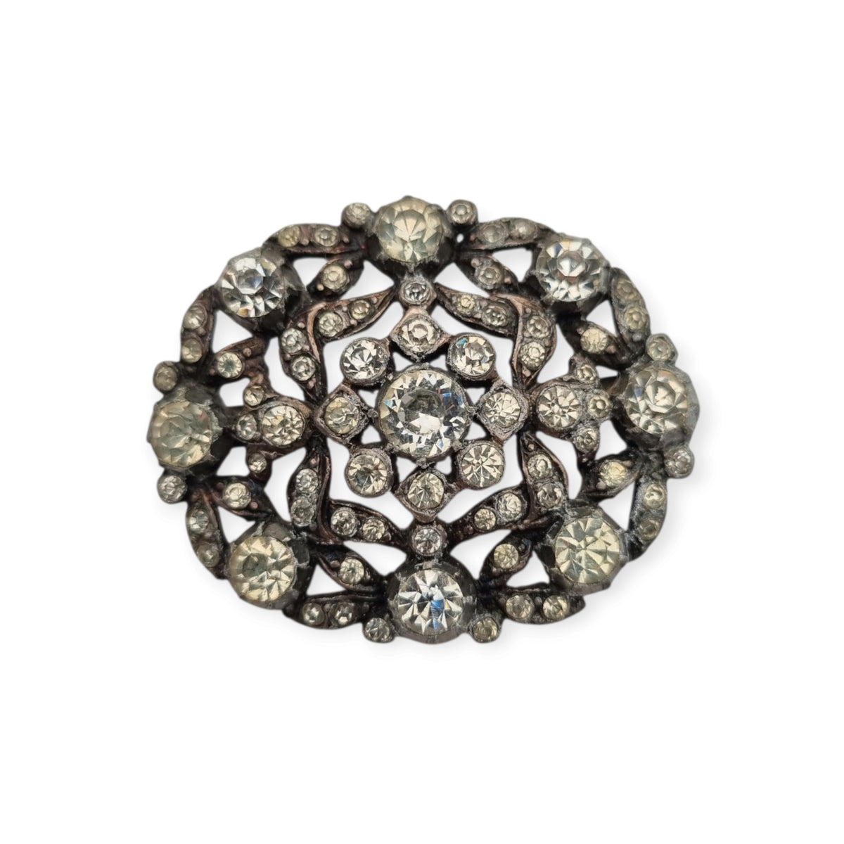 Broche vintage Art Déco de bisutería con pedrería y decoración floral, estilo Hollywood, Europa, ca. 1940–1950