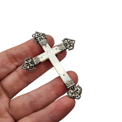 Antique French Catholic crucifix in silver and mother-of-pearl with Christ and openwork finials, circa 1900–1930