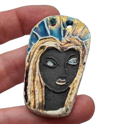 Handmade ceramic pendant with a Modernist Marian bust, enameled piece with golden highlights, European, 1960–1980s