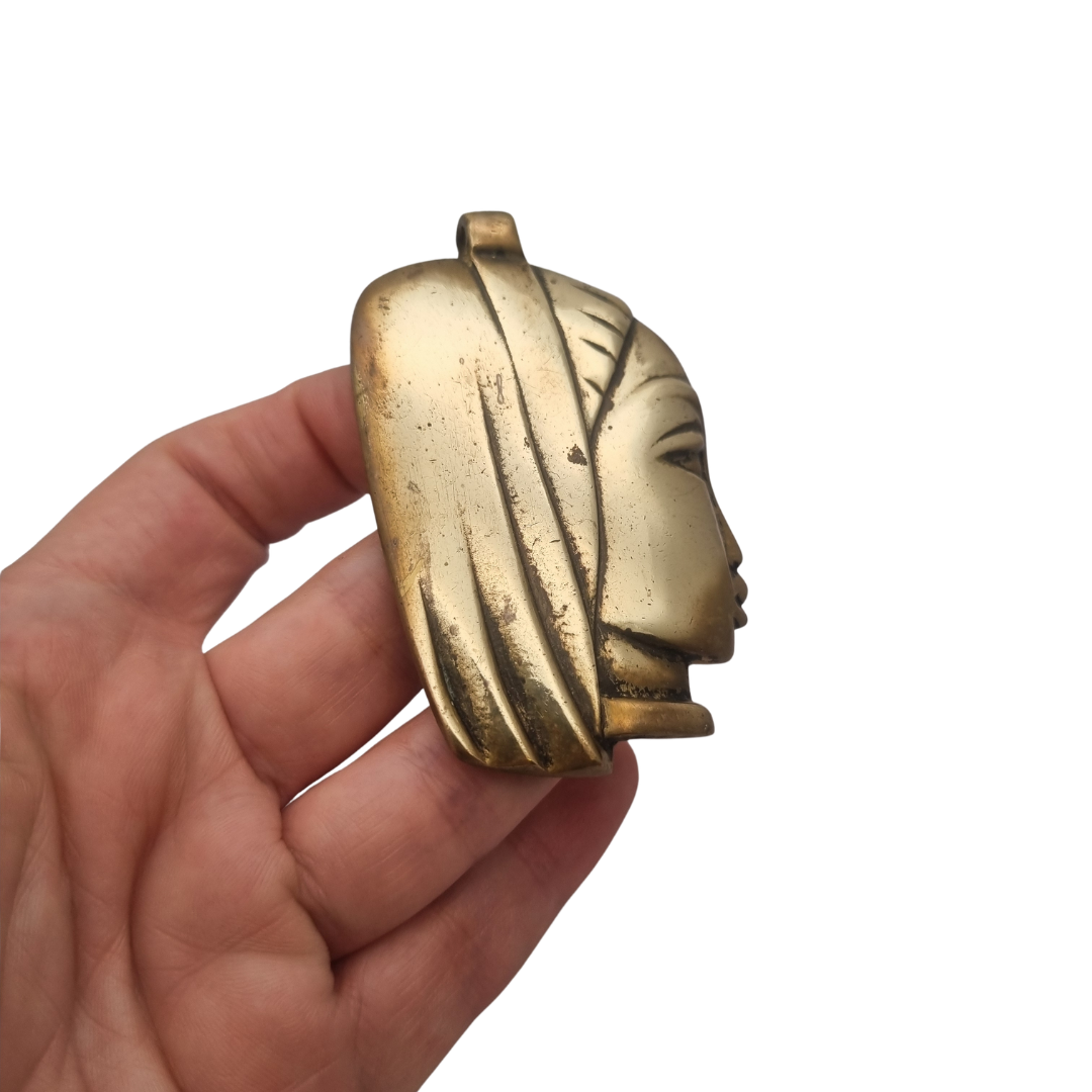 Large bronze sculptural pendant with a stylized female head, circa 1980-1990