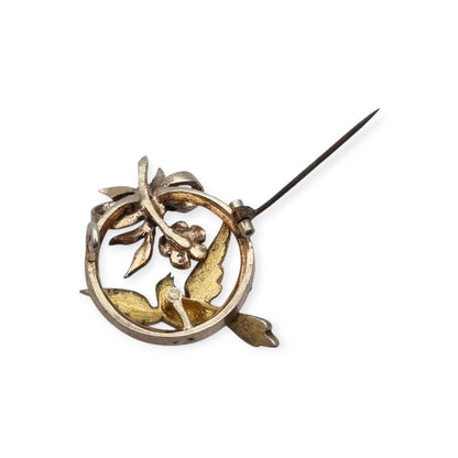 Broche eduardiano en plata con pájaro lazo perlas y rubí circa 1910