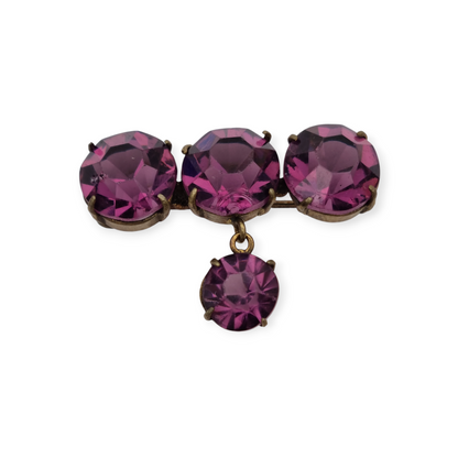Broche antiguo en latón con strass morado facetado colgante, circa 1930