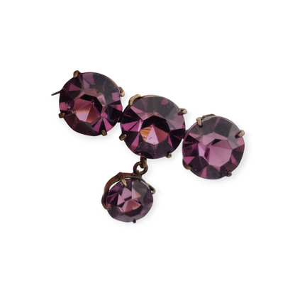 Broche antiguo en latón con strass morado facetado colgante, circa 1930