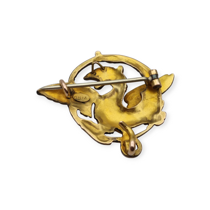 Broche Art Nouveau de grifo ORIA en oro laminado y ojo de rubí, circa 1910