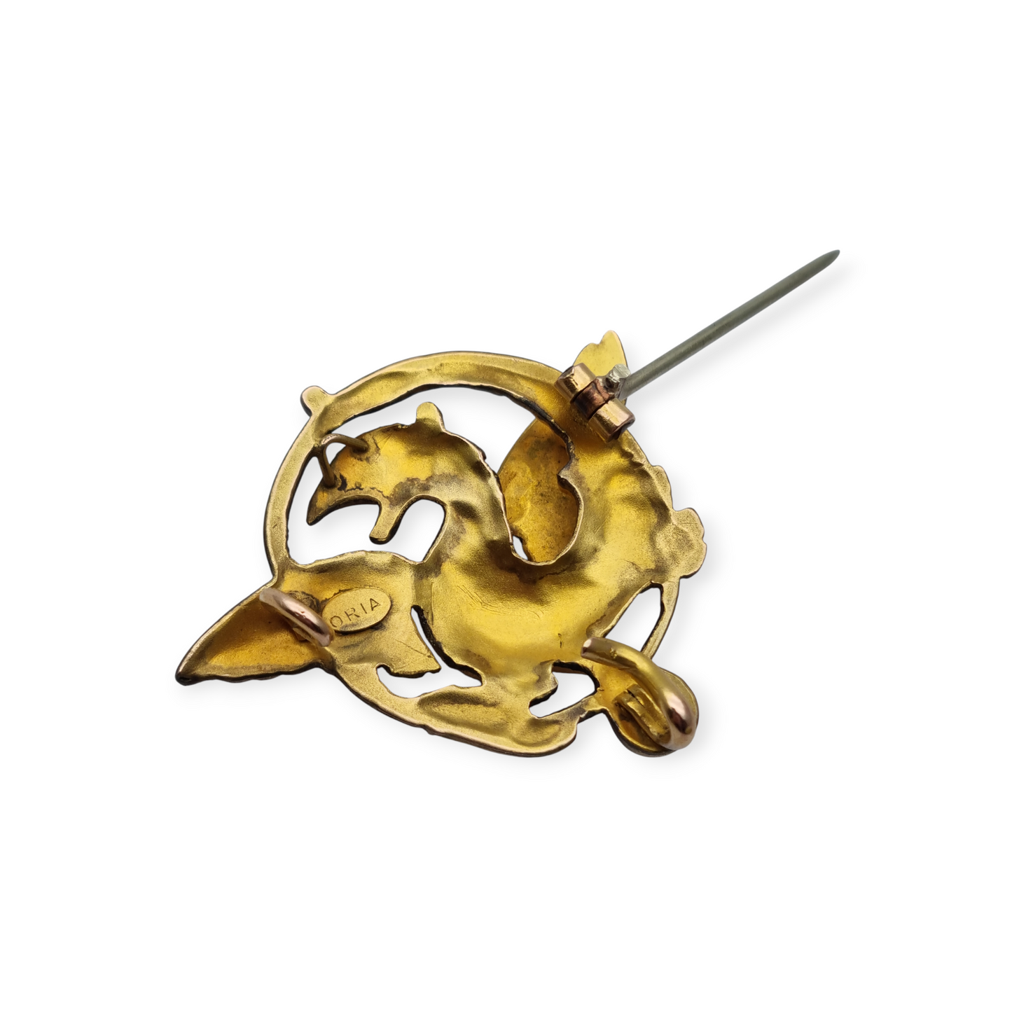 Broche Art Nouveau de grifo ORIA en oro laminado y ojo de rubí, circa 1910