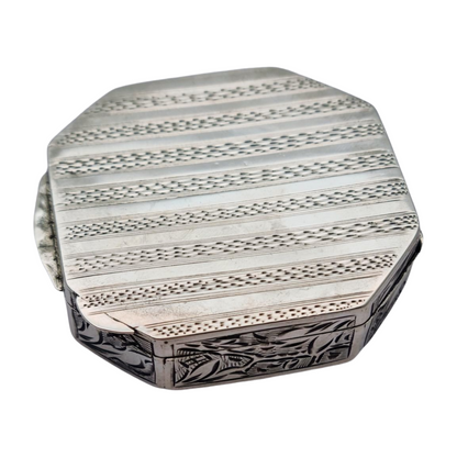 Antique octagonal powder compact in 800 silver engraved with butterflies and flowers, circa 1950