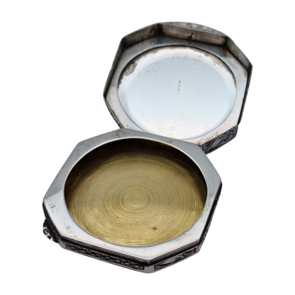 Antique octagonal powder compact in 800 silver engraved with butterflies and flowers, circa 1950