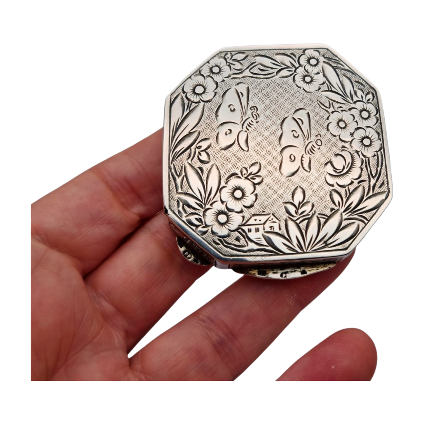 Antique octagonal powder compact in 800 silver engraved with butterflies and flowers, circa 1950