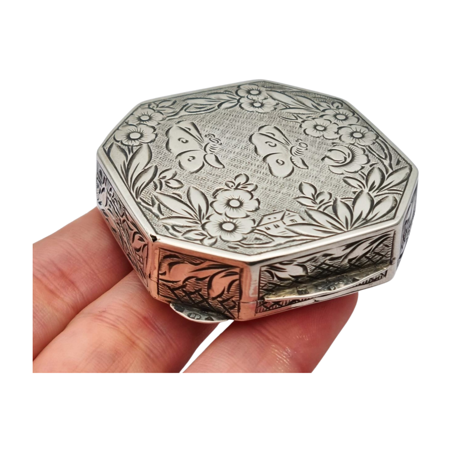 Antique octagonal powder compact in 800 silver engraved with butterflies and flowers, circa 1950