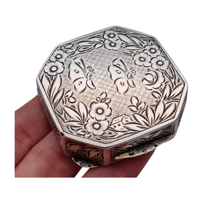 Antique octagonal powder compact in 800 silver engraved with butterflies and flowers, circa 1950
