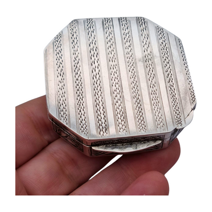 Antique octagonal powder compact in 800 silver engraved with butterflies and flowers, circa 1950