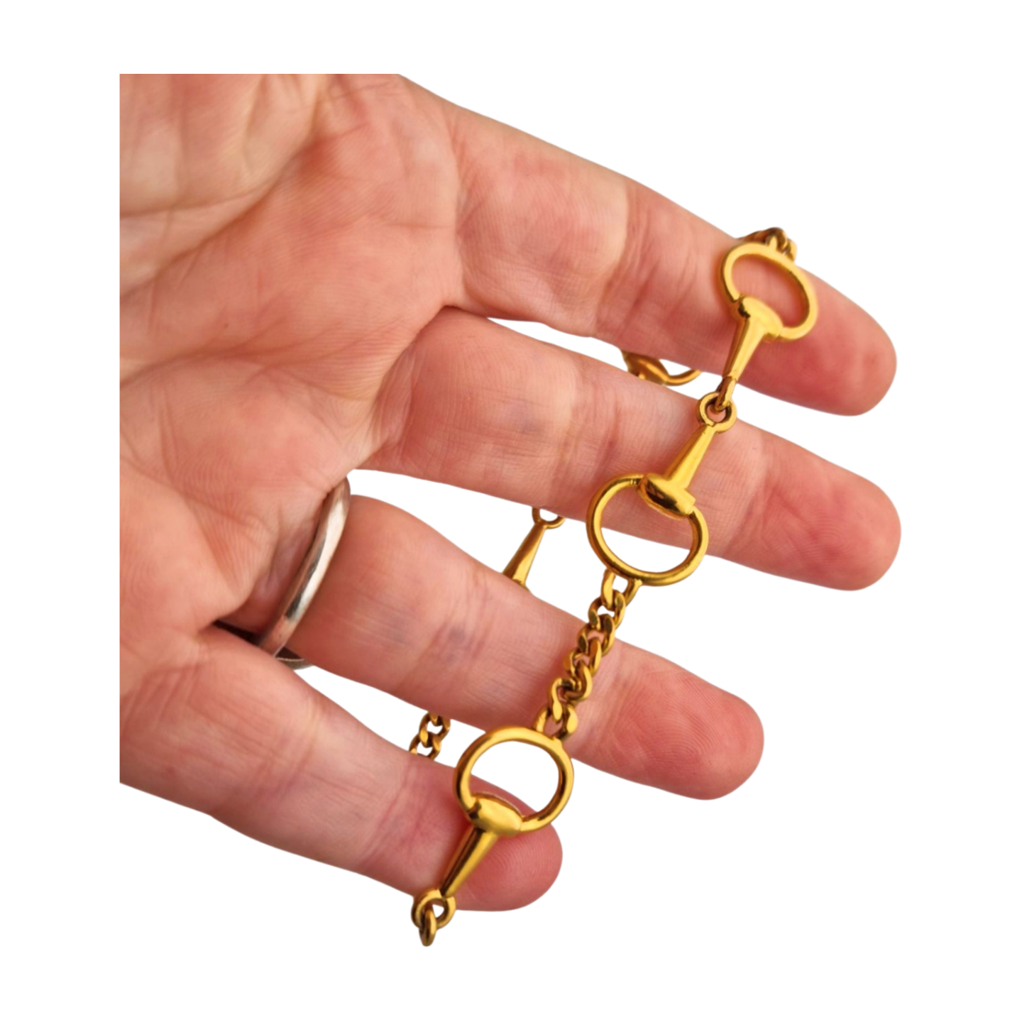 Pulsera vintage de diseño ecuestre chapada en oro, circa 1980.