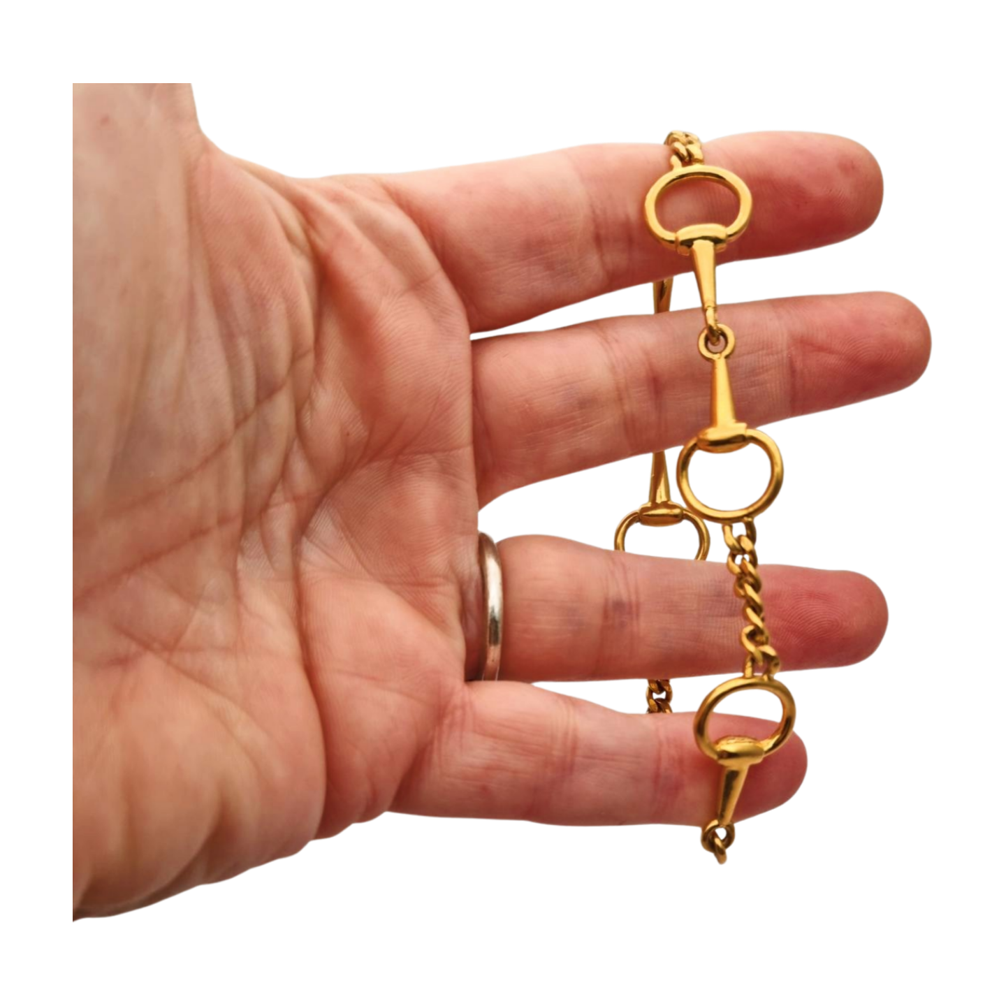 Pulsera vintage de diseño ecuestre chapada en oro, circa 1980.