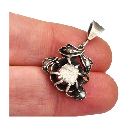 Victorian floral pendant in silver with diamonds and gold details, circa 1890