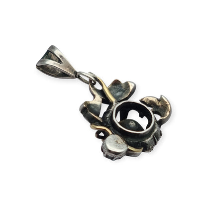 Victorian floral pendant in silver with diamonds and gold details, circa 1890