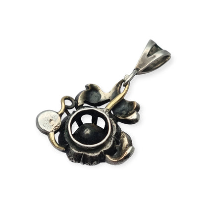 Victorian floral pendant in silver with diamonds and gold details, circa 1890