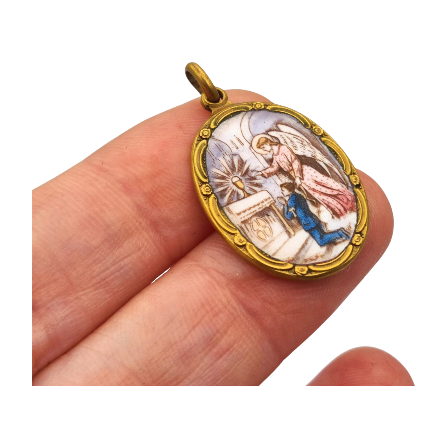 Art Nouveau religious medal in metal and enamel, circa 1910-20, angel and child in adoration