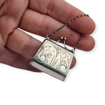 Vintage 925 silver coin purse with chain and floral engraving, 1960s.