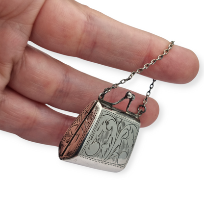 Vintage 925 silver coin purse with chain and floral engraving, 1960s.