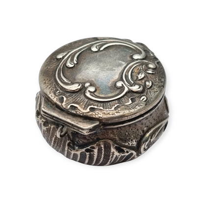 Art Nouveau silver chatelaine box with floral relief, signed JB, France, circa 1920.