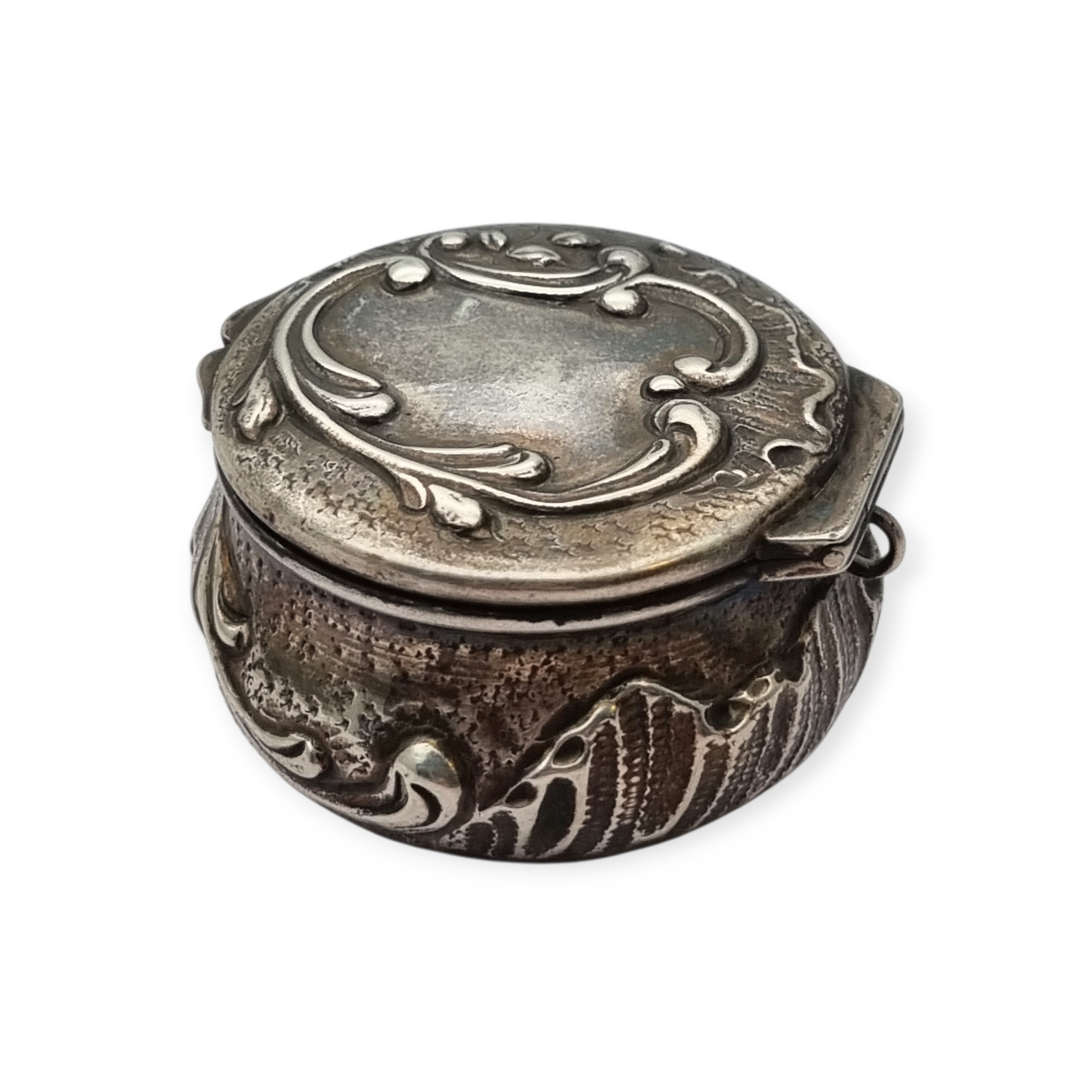 Art Nouveau silver chatelaine box with floral relief, signed JB, France, circa 1920.