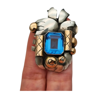 Art Deco Catalan brooch in silver with gold accents and simulated aquamarine, circa 1930-1940