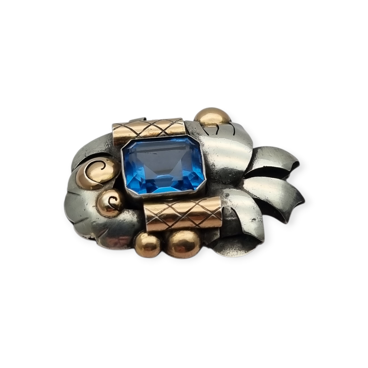 Art Deco Catalan brooch in silver with gold accents and simulated aquamarine, circa 1930-1940